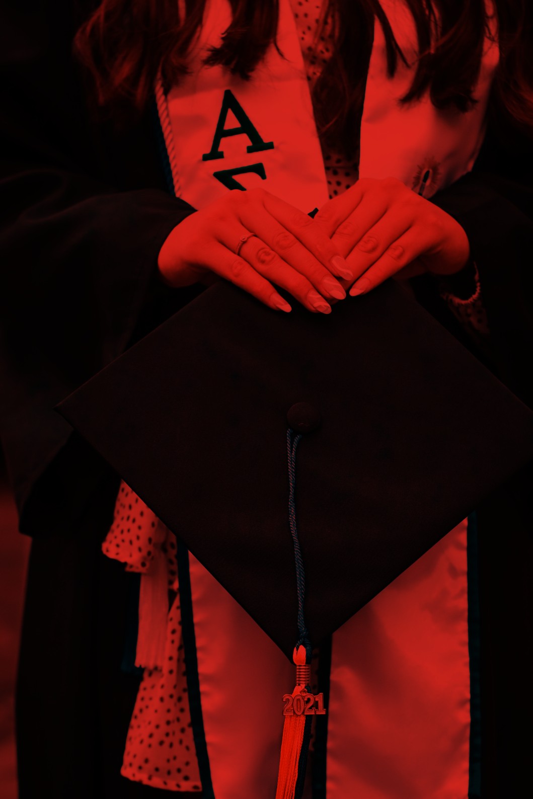 Student holding her mortarboard hat